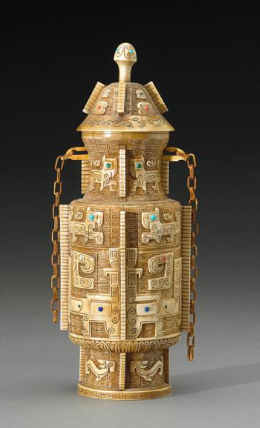 Appraisal: A pieced and tinted ivory covered urn th Century Of