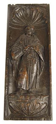 Appraisal: A carved and stained oak panel depicting St Peter standing