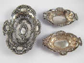 Appraisal: Silver A pair of embossed bonbon dishes by Nathan and