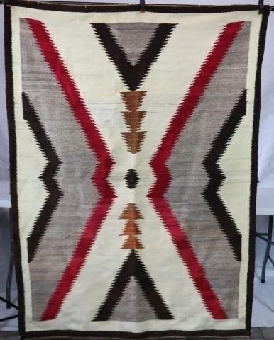 Appraisal: NAVAJO HOUR GLASS DESIGN RUG CA WITH RED BLACK AND