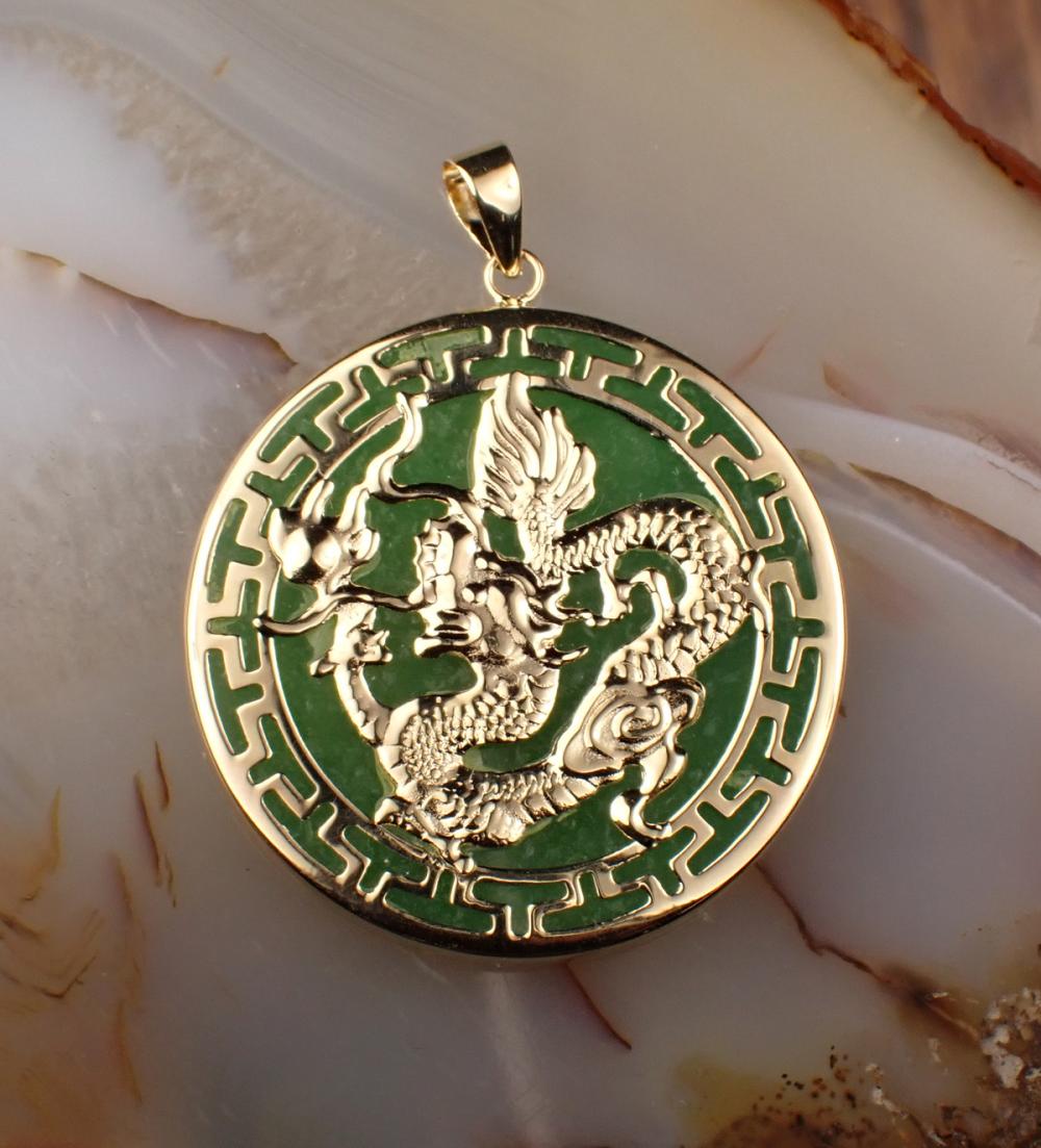 Appraisal: JADE AND FOURTEEN KARAT GOLD PENDANT MEDALLION the green jade