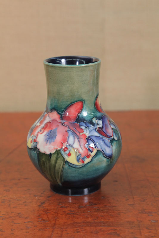 Appraisal: MOORCROFT VASE Bulbous form in the Orchids pattern on a