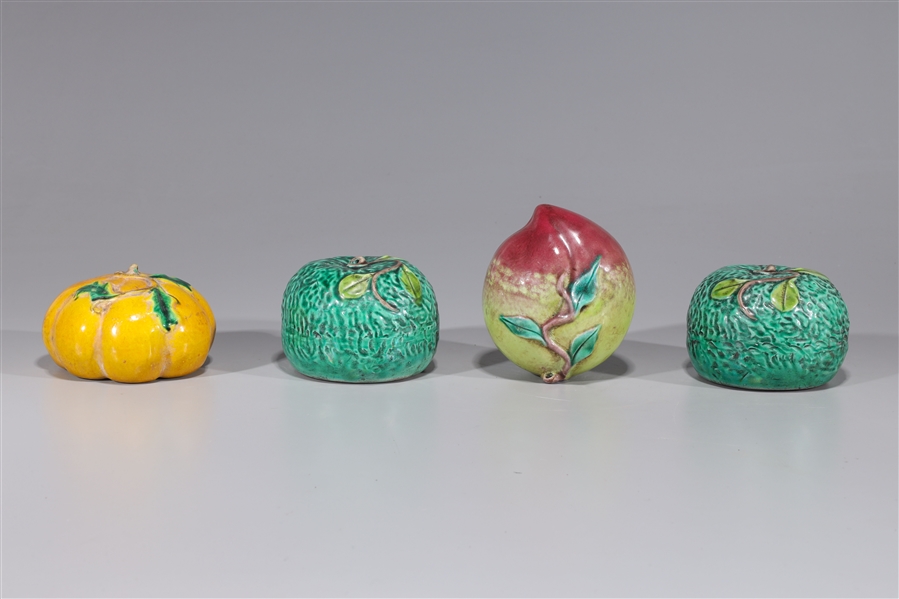 Appraisal: Lot of four Chinese porcelain fruit and vegetable sculptures minor