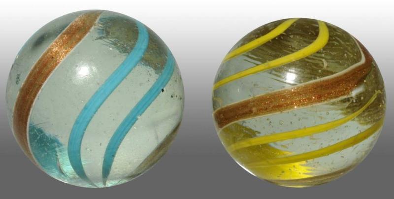 Appraisal: Lot of Lutz Marbles Description Includes one with yellow bands