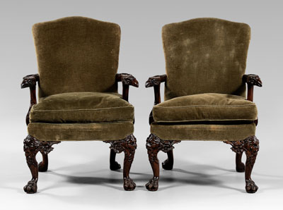 Appraisal: Pair Chippendale style library chairs each with boldly carved shaped