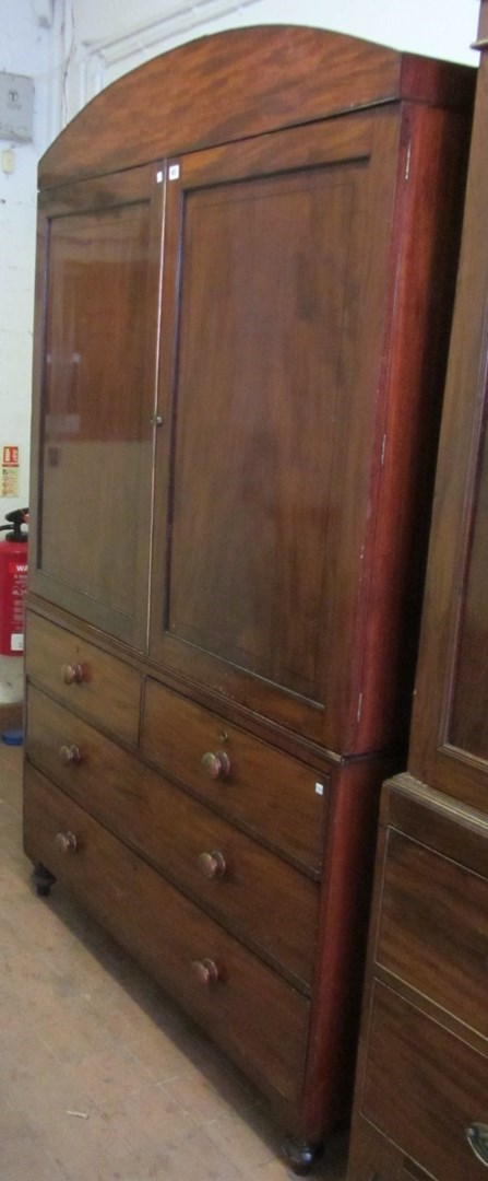 Appraisal: An early th century inlaid mahogany linen press the pair