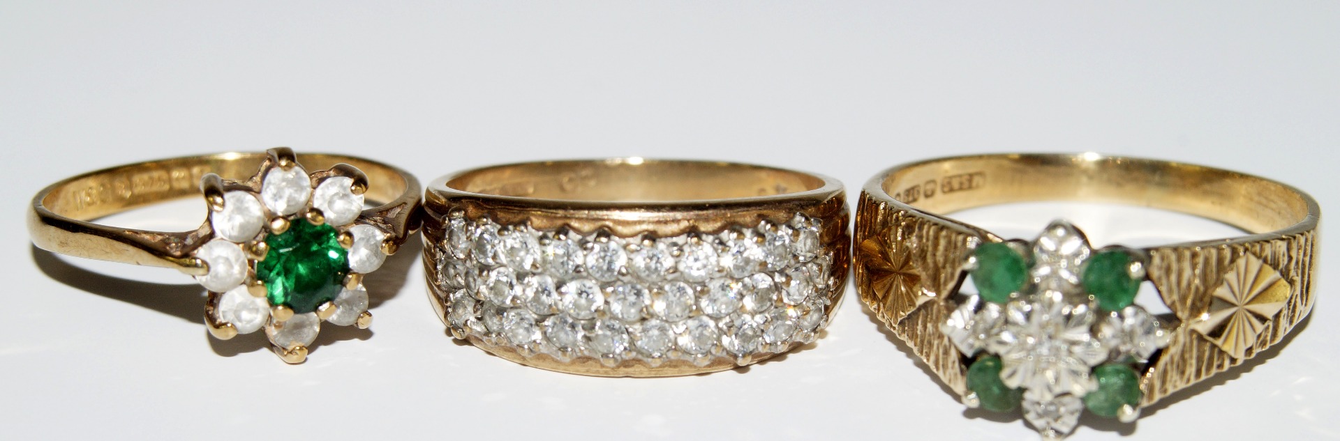 Appraisal: Three modern ct gold rings including two cluster rings and