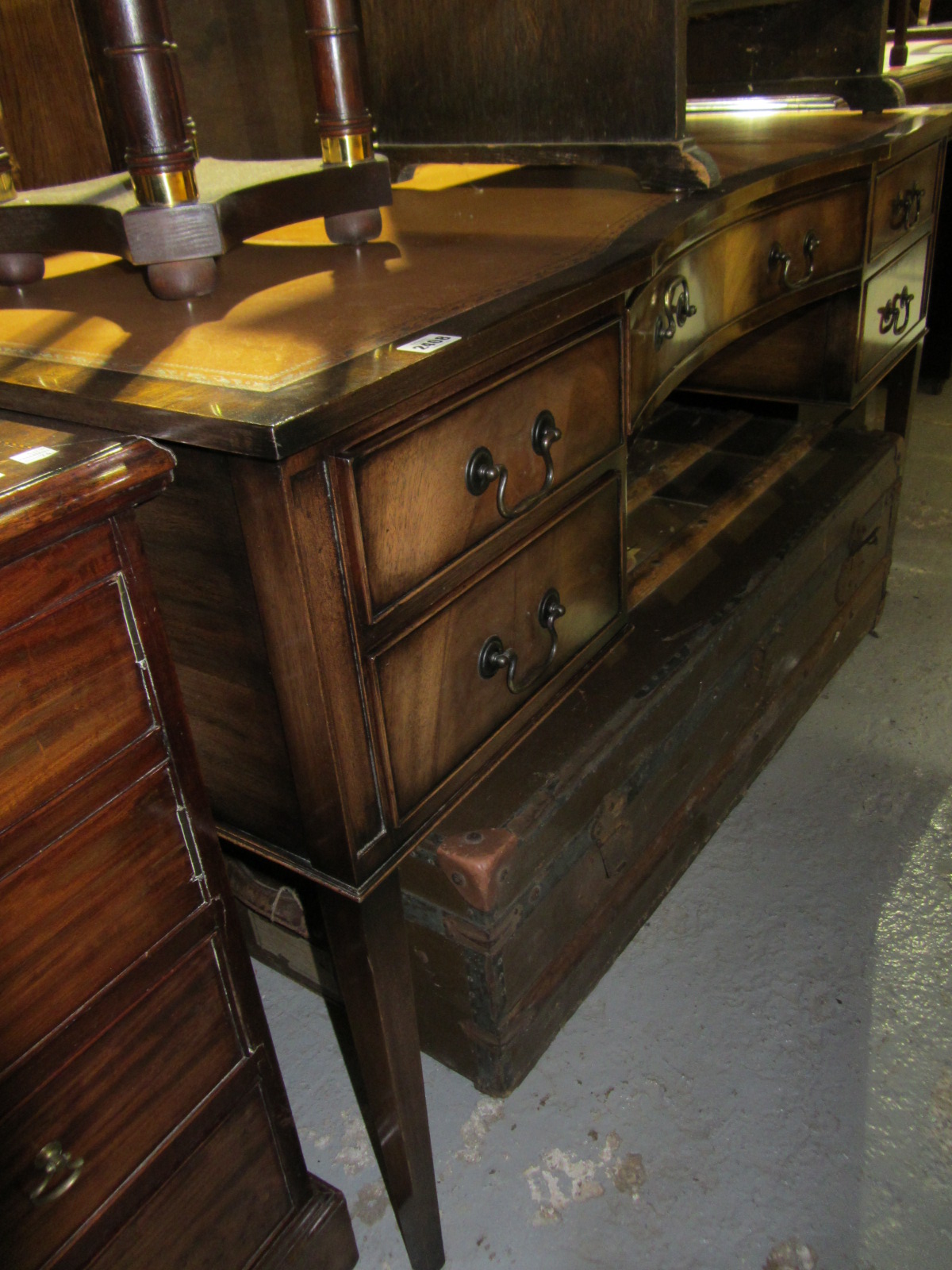 Appraisal: A th century mahogany serpentine sideboard