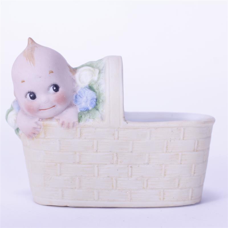 Appraisal: German Bisque Kewpie Doll Baby in Basket figure crown mark