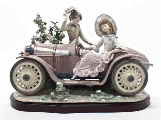 Appraisal: A Lladro Porcelain Figural Group Young Couple with Car issued