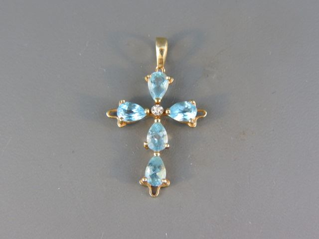 Appraisal: Blue Topaz and Diamond Cross Pendant pear shape gems totaling