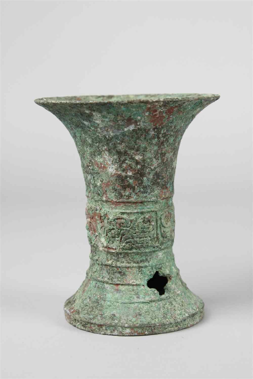 Appraisal: CHINESE BRONZE GU-FORM VASE SHANG DYNASTY the small flared beaker