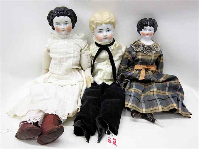 Appraisal: THREE TH CENTURY CHINA HEAD DOLLS with cloth bodies two