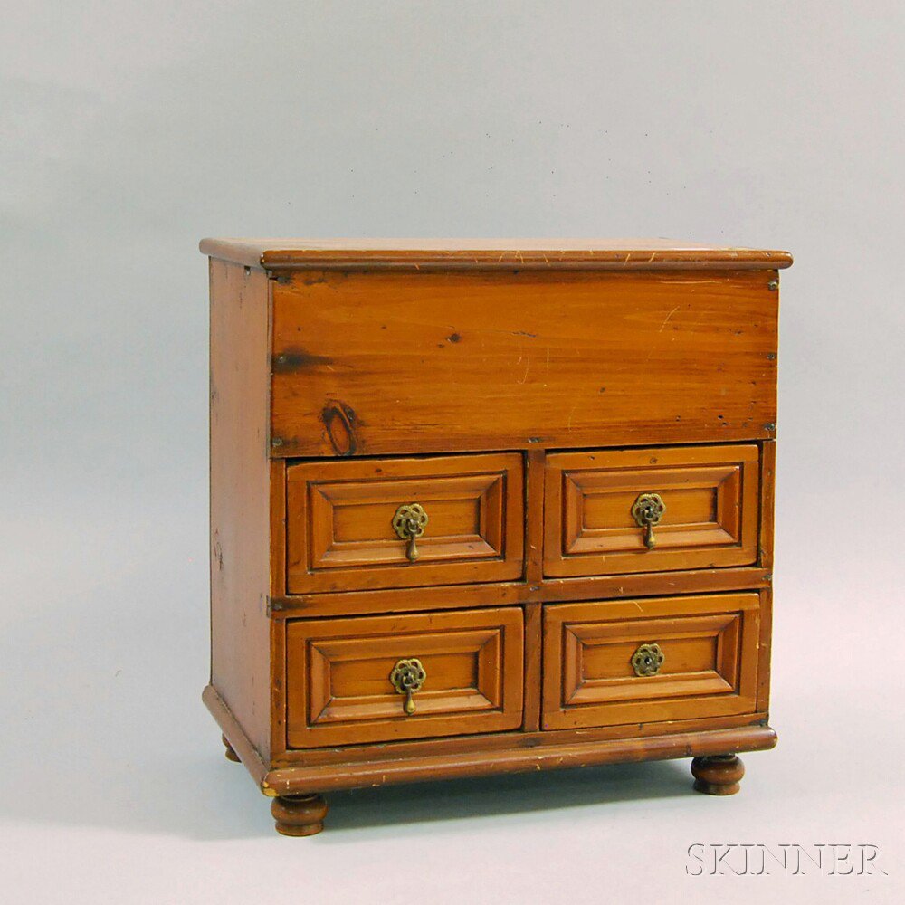 Appraisal: Miniature Pine Pilgrim-style Four-drawer Blanket Chest the hinged top opening