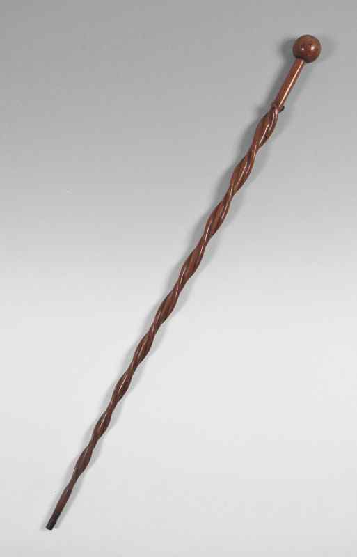 Appraisal: FOLK ART CARVED WALKING STICK WITH SNAKES Carved ball pommel