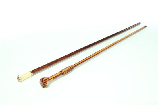 Appraisal: TWO WALKING STICKS American rosewood and ivory Dated and signed