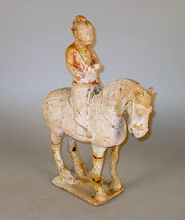 Appraisal: Chinese Tang pottery figure of a guardian on horse tang