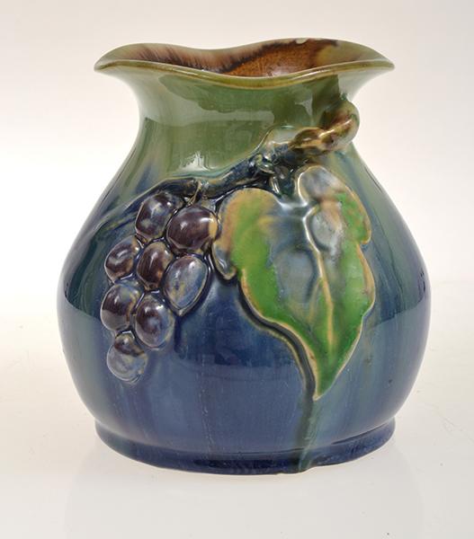 Appraisal: REMUED VASE APPLIED WITH GRAPE AND VINE LEAVES IN GREEN