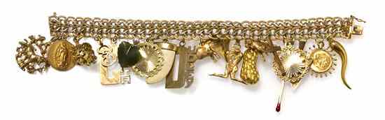 Appraisal: A Karat Yellow Gold Charm Bracelet with Attached Charms consisting