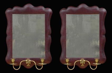 Appraisal: PAIR OF ROCOCO-STYLE LEATHER-COVERED SMALL MIRRORS WITH BRASS CANDLE ARMS