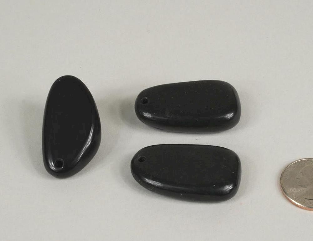 Appraisal: Three Chinese Carved Black Jade Pebble Pendants Three Chinese carved