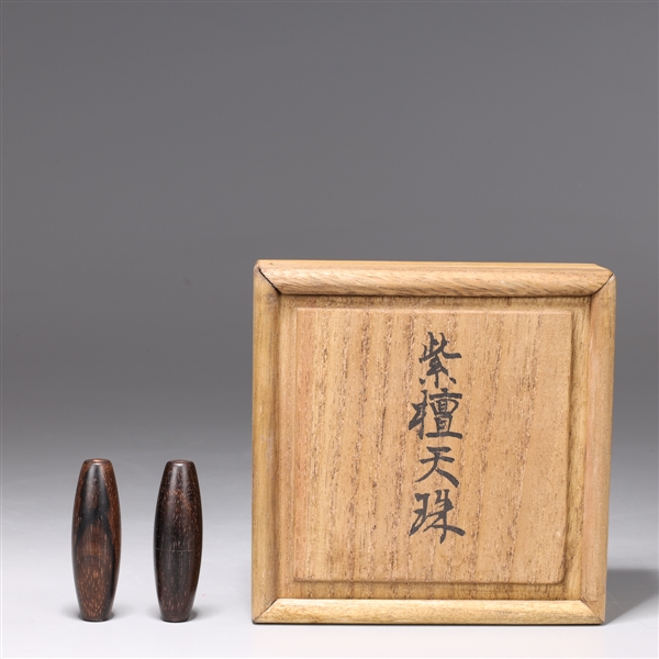 Appraisal: Two Chinese carved wood beads in Japanese wood box L