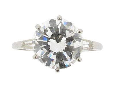 Appraisal: A diamond solitaire ring The circular brilliant cut diamond weighs