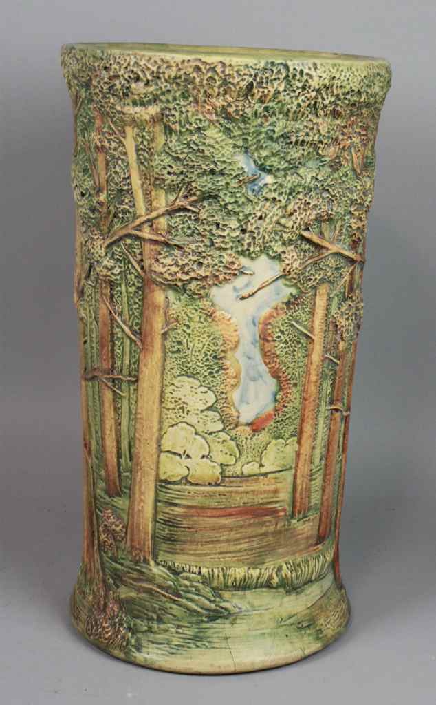 Appraisal: WELLER POTTERY FOREST PATTERN UMBRELLA STAND typically decorated with a