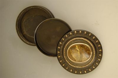 Appraisal: An early th century circular tortoiseshell 'secret' snuff box the