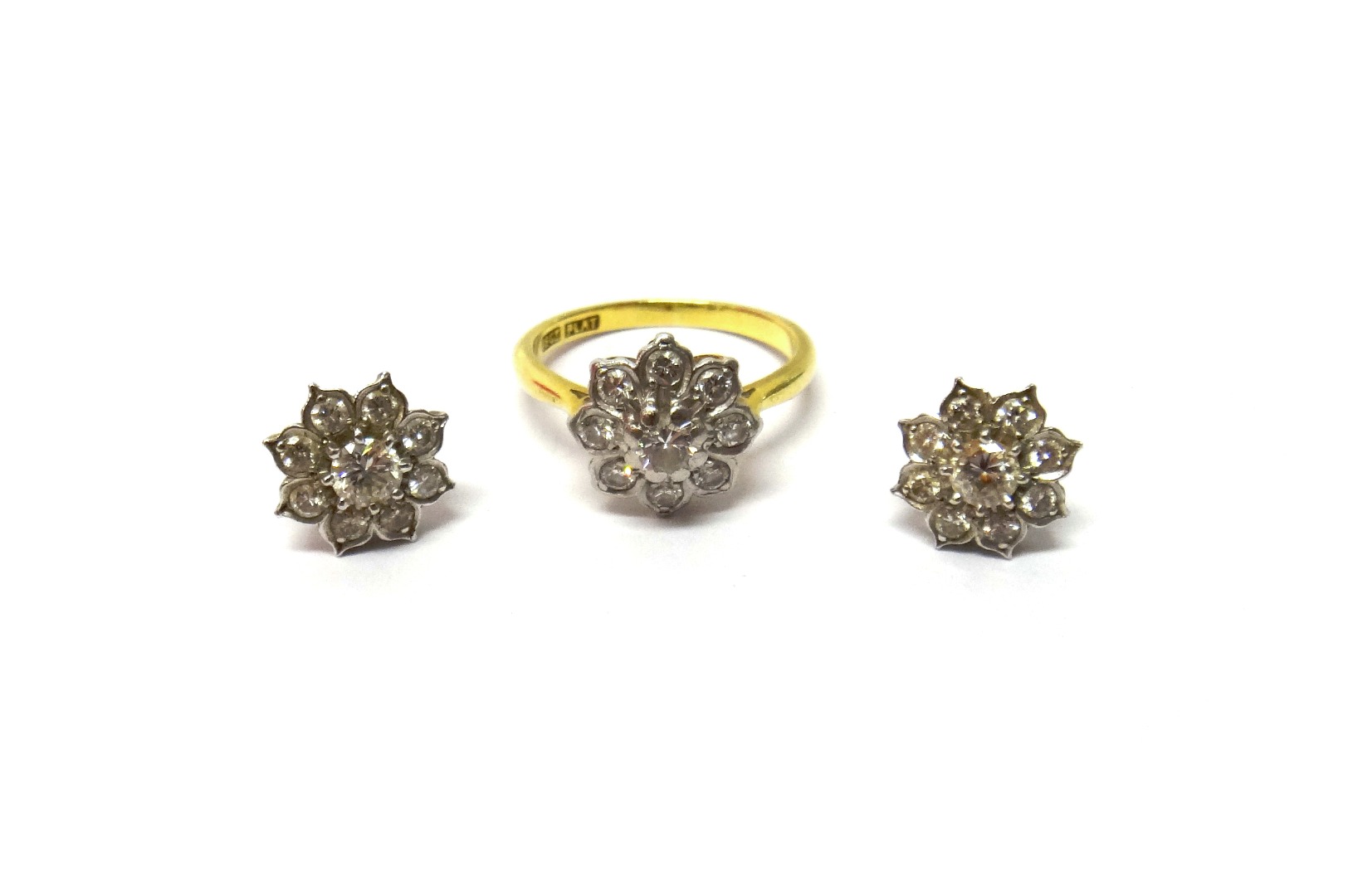 Appraisal: A gold and platinum diamond set nine stone cluster ring