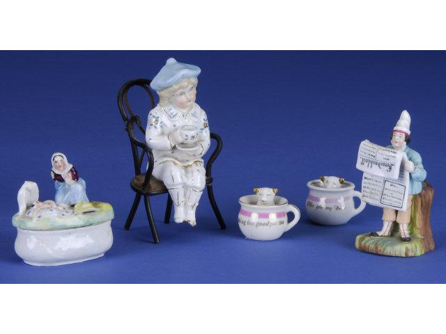 Appraisal: Lot Five German Figurines Germany ca glazed porcelain Includes child