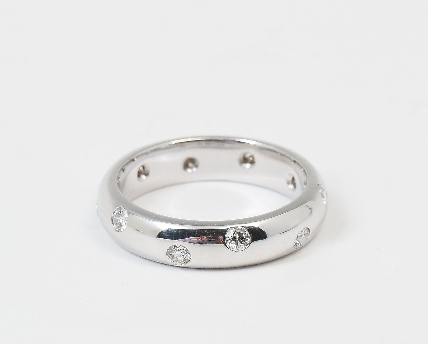 Appraisal: K MM DOMED BAND WITH DIAMONDS Size K white gold