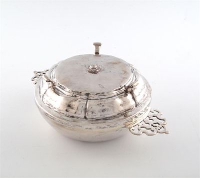 Appraisal: An th century continental silver two handled porringer and cover