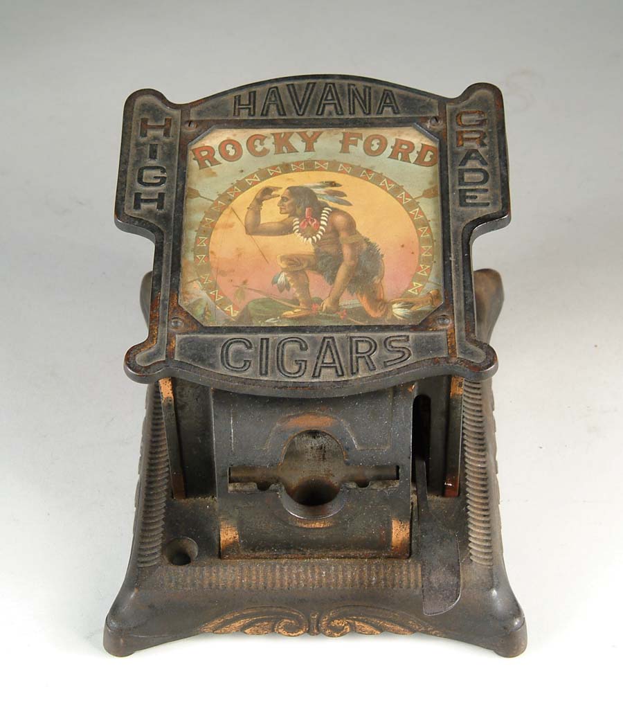 Appraisal: ROCKY FORD CAST IRON CIGAR CUTTER Copper highlighted cast iron