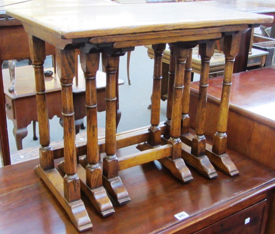 Appraisal: A nest of three th century oak occasional tables on