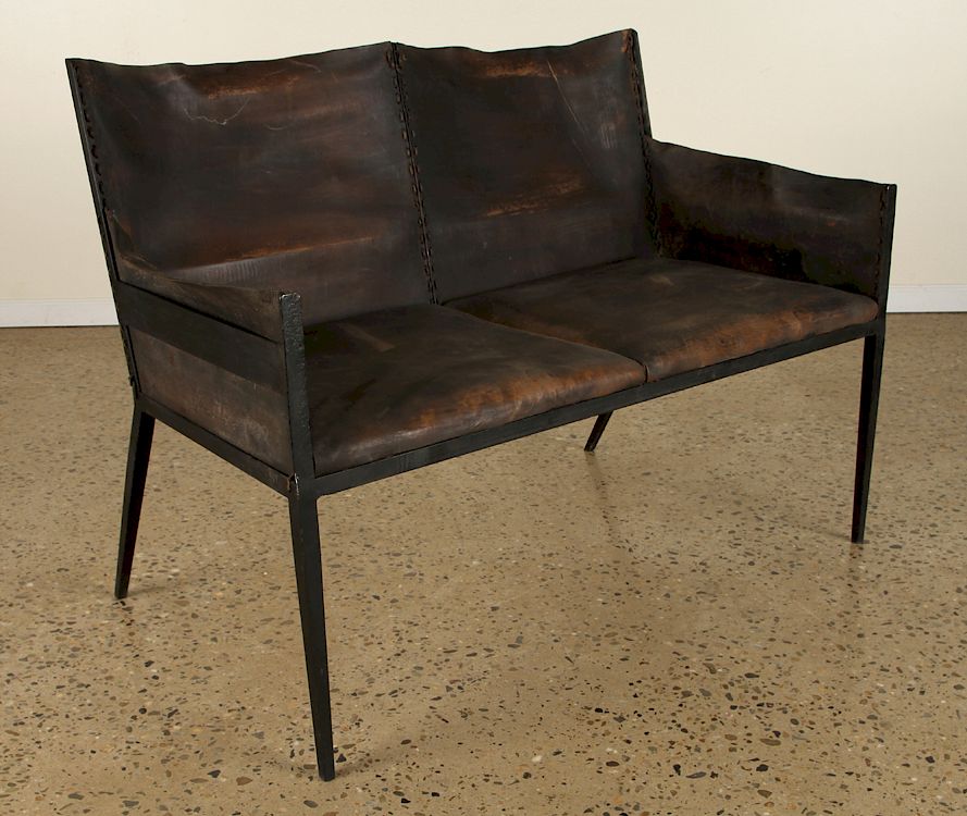 Appraisal: IRON LEATHER SETTEE MANNER OF JEAN-MICHEL FRANK An iron and