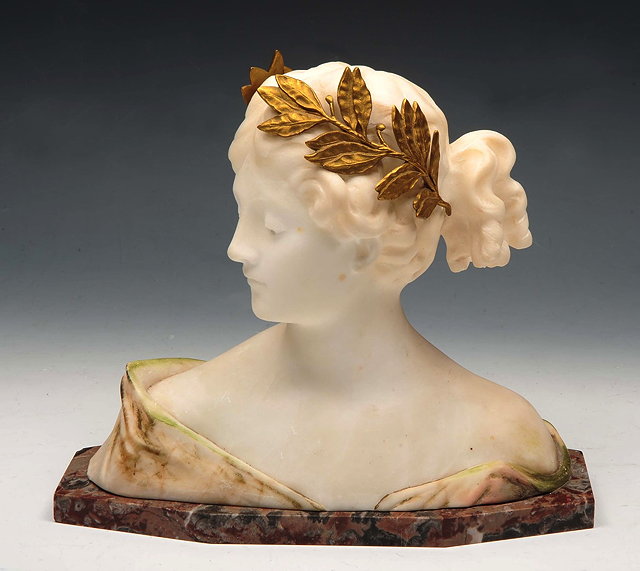 Appraisal: AN ITALIAN MARBLE BUST of a young maiden with gilt