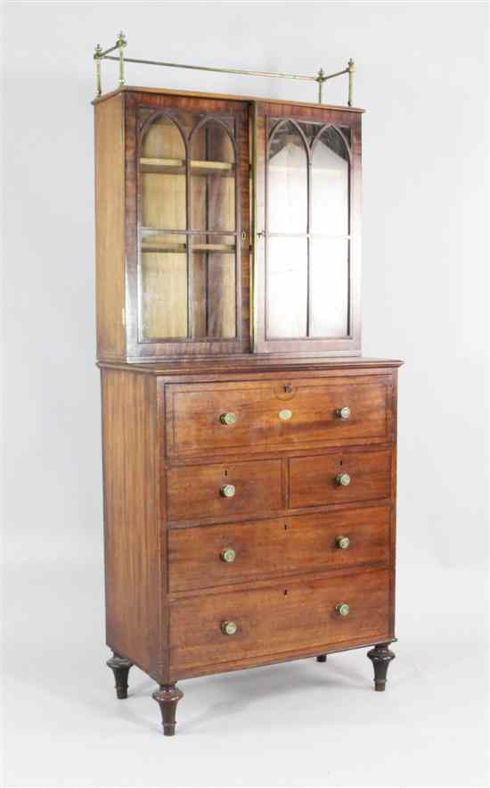 Appraisal: A Regency mahogany secretaire cabinet with two glazed doors fitted