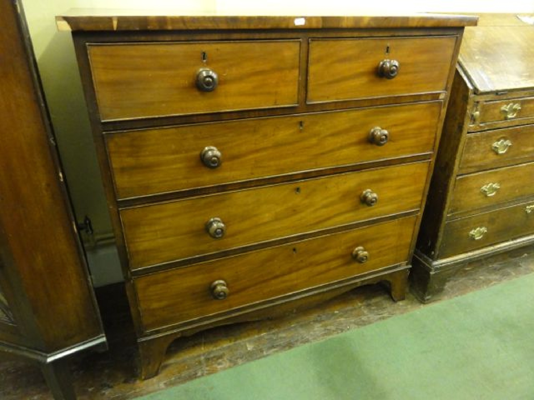 Appraisal: A th century mahogany bedroom chest of three long and