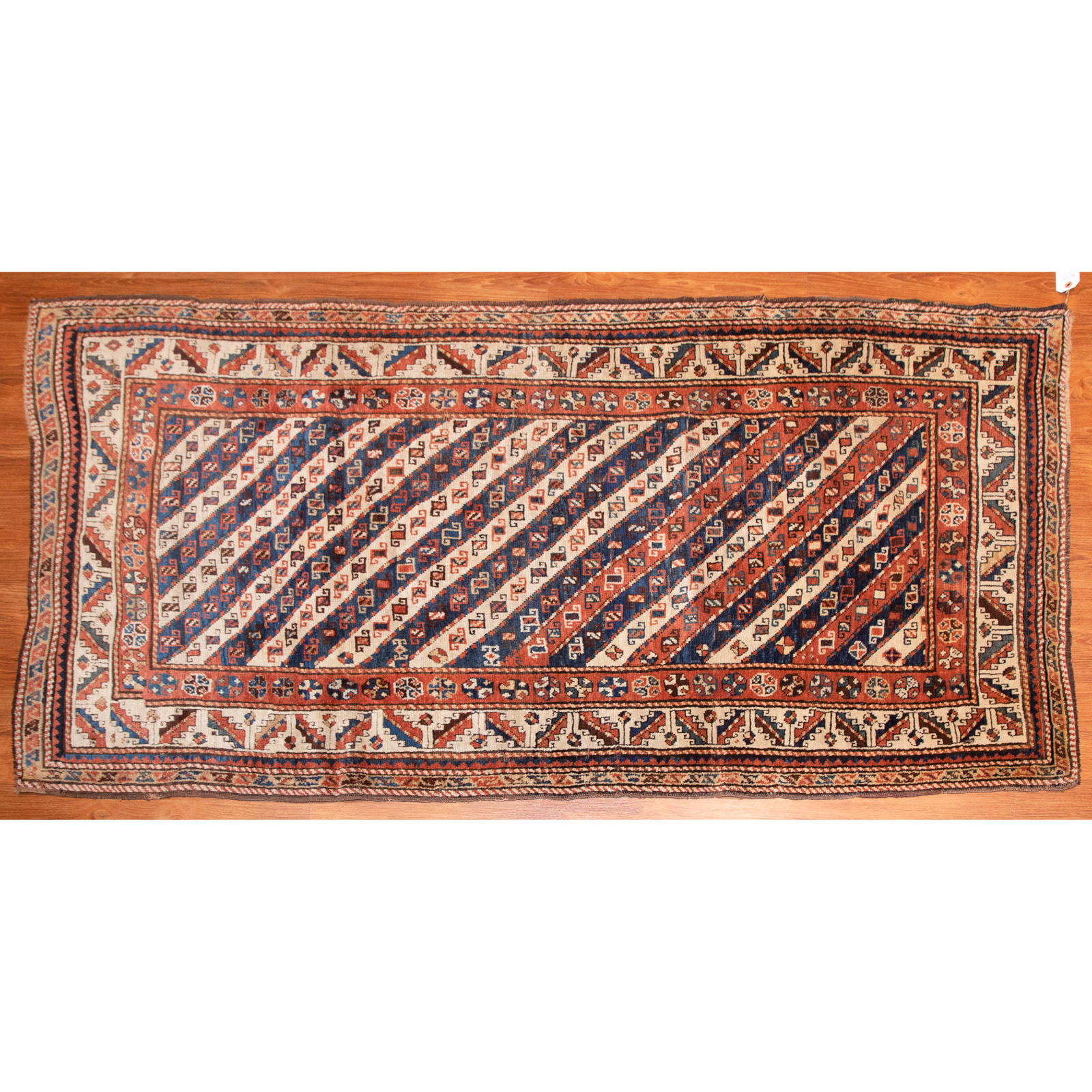 Appraisal: ANTIQUE CAUCASIAN RUG X First quarter- th century hand-knotted wool