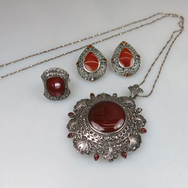 Appraisal: sterling silver pendant ring and earrings all set with carnelian