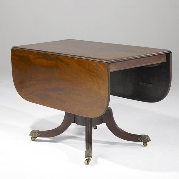 Appraisal: ENGLISH REGENCY PEDESTAL DROP-LEAF TABLE Mahogany with brass topped feet