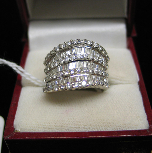 Appraisal: DIAMOND AND FOURTEEN KARAT WHITE GOLD RING with round-cut diamonds