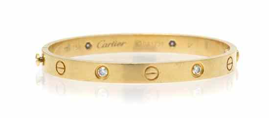 Appraisal: An Karat Yellow Gold and Diamond Love Bracelet Cartier containing