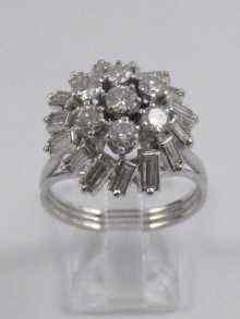 Appraisal: A white metal tests platinum diamond cocktail ring set with