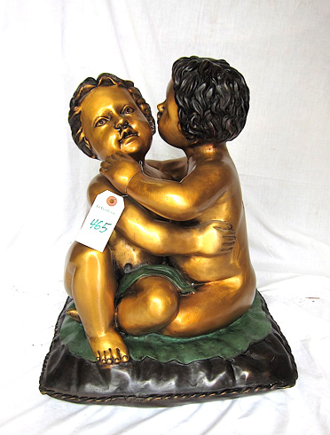 Appraisal: FIGURAL BRONZE SCULPTURE twin infants seated on a pillow unsigned