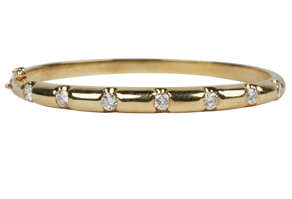 Appraisal: KARAT YELLOW GOLD DIAMOND BANGLE BRACELETcontaining seven full cut diamonds