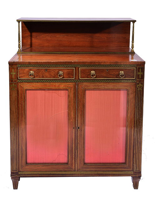 Appraisal: A REGENCY ROSEWOOD AND BRASS INLAID CHIFFONIER fitted two oak