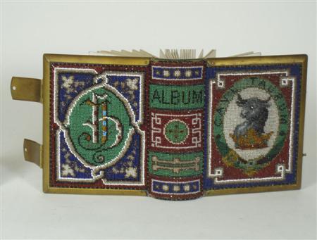 Appraisal: A th century bead work covered photograph album with a