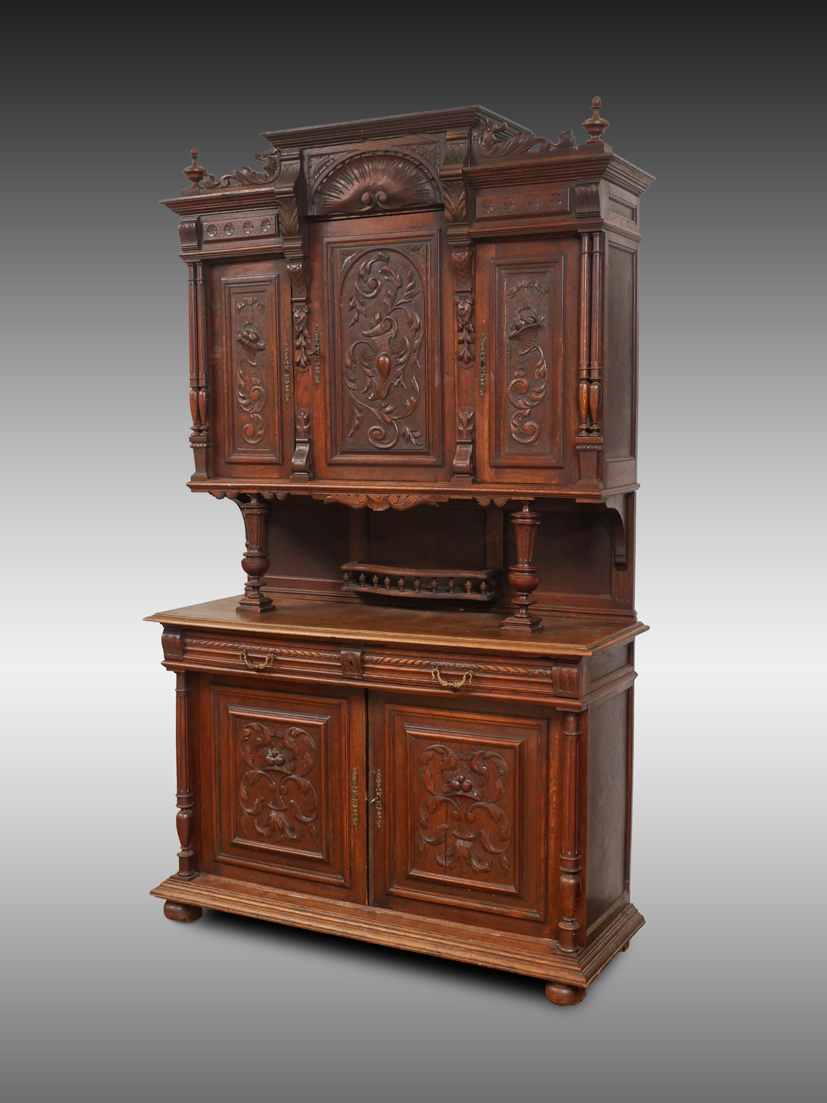 Appraisal: CARVED CARVED OAK STEPBACK CUPBOARD Elaborately carved Oak Stepback Cupboard